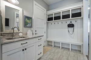 Mudroom featuring sink