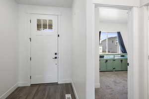 View of carpeted foyer