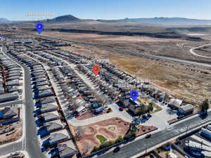 Birds eye view of property featuring a mountain view