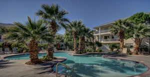 View of swimming pool with a patio area