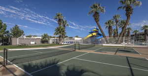 View of tennis court featuring basketball court and a playground