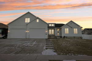 View of front of home featuring a garage