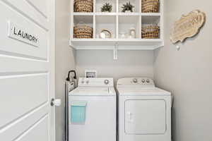 Laundry area featuring separate washer and dryer