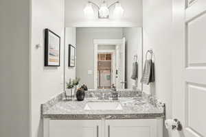 Bathroom with vanity and independent washer and dryer