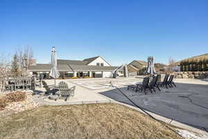 Exterior space featuring a lawn and a patio