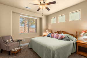 Bedroom with carpet and ceiling fan