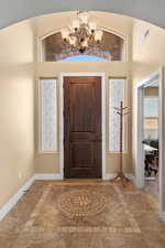 Foyer entrance with a chandelier