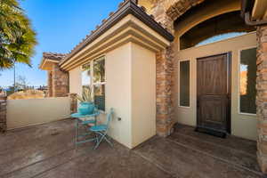 View of exterior entry featuring a patio area