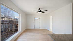 Foyer featuring ceiling fan and light hardwood / wood-style flooring