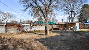 View of yard featuring a storage unit