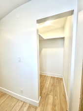 Corridor featuring hardwood / wood-style floors