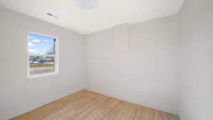 Spare room with light hardwood / wood-style flooring