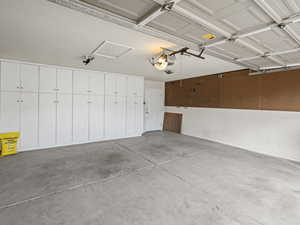 Garage featuring a garage door opener