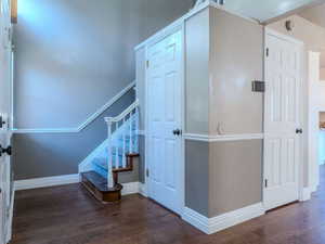 Stairway with hardwood / wood-style flooring