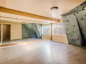 Spare room featuring hardwood / wood-style flooring