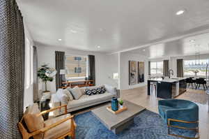 Living room with sink and light hardwood / wood-style floors