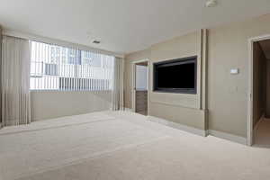 Unfurnished bedroom with carpet