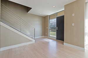 Foyer with light hardwood / wood-style floors