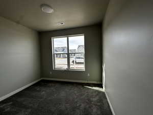 View of carpeted spare room