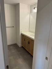 Bathroom featuring a textured ceiling and vanity