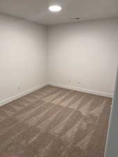 View of carpeted spare room