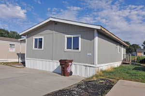 View of property exterior featuring a patio area