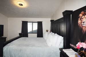 Bedroom with a textured ceiling