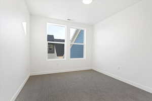 View of carpeted spare room