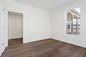 Spare room featuring dark hardwood / wood-style floors