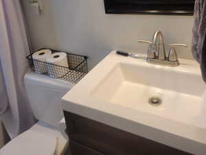 Bathroom featuring toilet and vanity