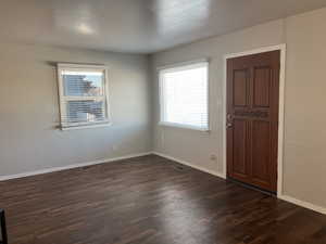 Foyer featuring dark hardwood / wood-style flooring