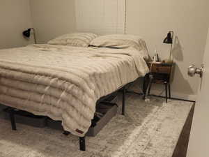 Bedroom featuring wood-type flooring