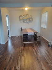 Dining room featuring dark wood-type flooring