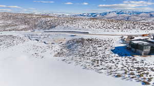 Snowy aerial view with a mountain view