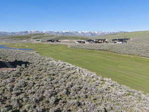 Surrounding community featuring a mountain view and view of golf course