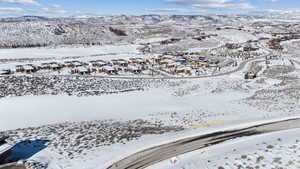 Snowy aerial view featuring a mountain view