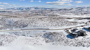 Snowy aerial view featuring a mountain view