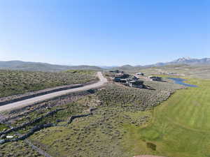 Aerial view of a water and mountain view and a golf club