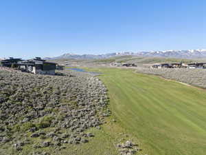 View of yard featuring a mountain view and golf course view