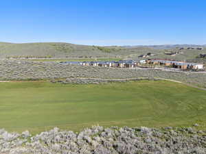 View of home's community with a mountain view and golf course view