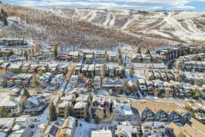 Snowy aerial view featuring a mountain view