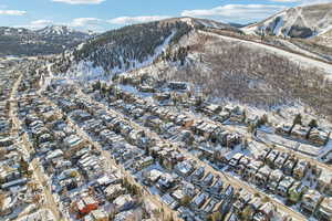 Snowy aerial view featuring a mountain view