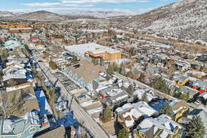 Snowy aerial view with a mountain view