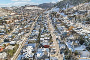 Snowy aerial view with a mountain view