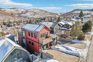 Snowy aerial view featuring a mountain view