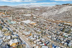 Snowy aerial view featuring a mountain view