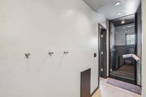 Bathroom with tile patterned floors and walk in shower