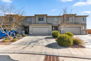 View of front of property with a garage