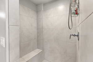 Bathroom with tiled shower