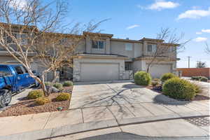 View of front of property featuring a garage